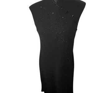 Black beaded dress detailed bead design and high neck collar. Size 10.